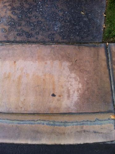 Battery Acid Stains on Colored Concrete Before